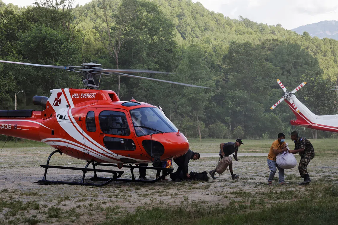 South Korean families push for helicopter access in Nepal flood search