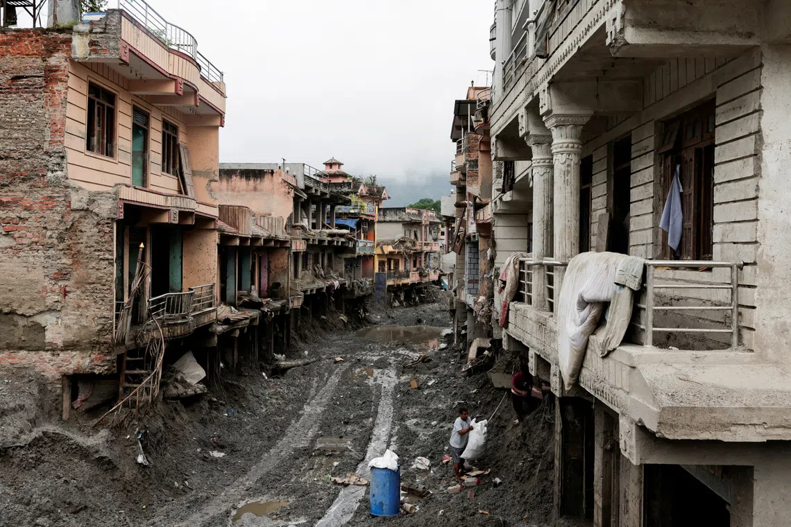 Nepal floods serve as climate change warning, PM says