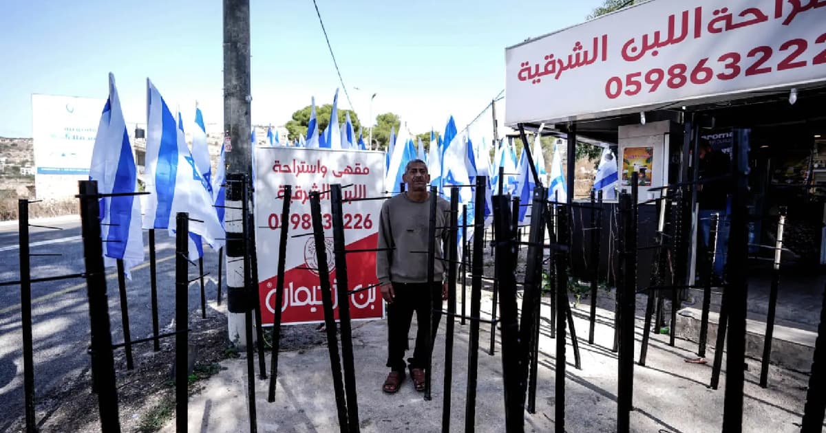 Israeli flags placed outside Palestinian cafe in disputed area