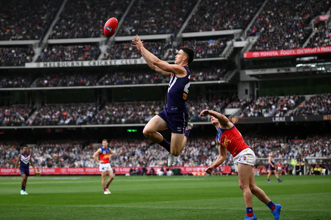 Brisbane Lions secure third consecutive AFL premiership in MCG thriller