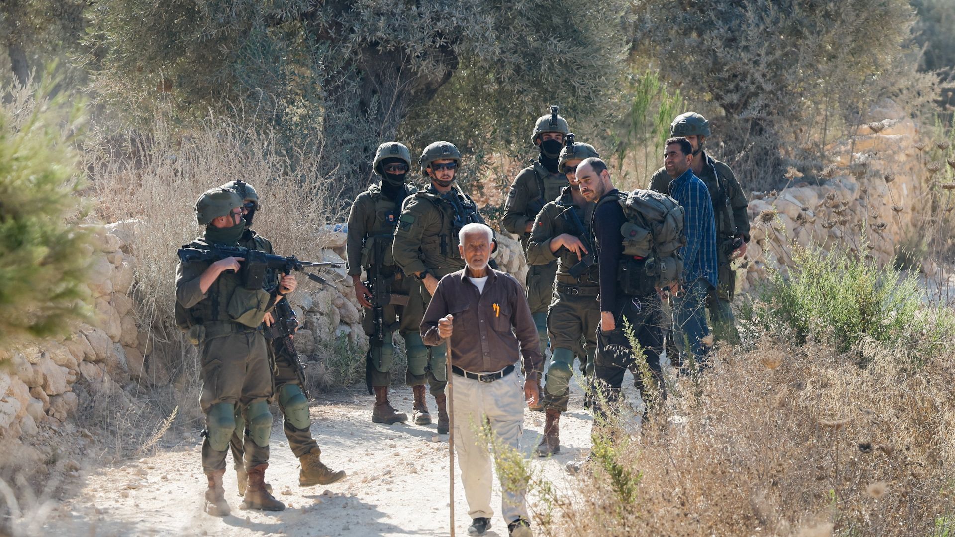 Israeli settlers clash with Palestinian farmers during West Bank olive harvest