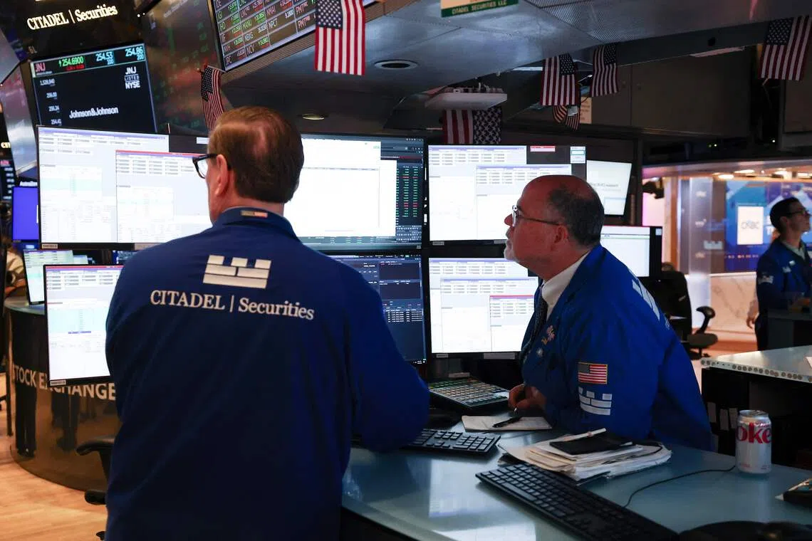 Nasdaq hits record peak as earnings outlook bolsters market sentiment