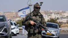 Five Israelis wounded in West Bank shooting; two attackers killed