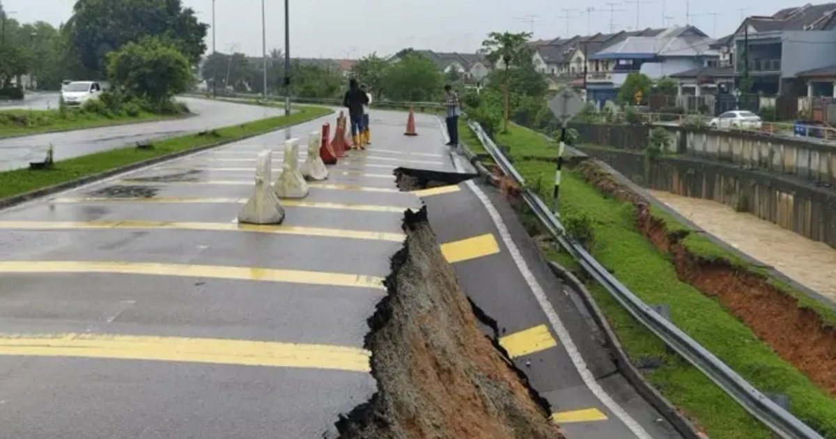 Johor road section caves in following intense rainfall