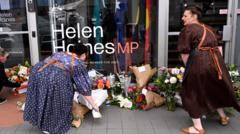 Man charged in assault on Australian MP; suspect's family cites long-standing ties