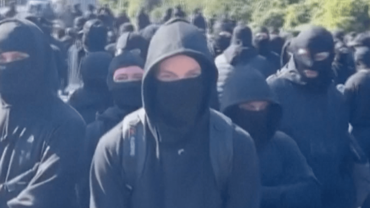 Masked activists disrupt traffic at England's Dover Port in protest