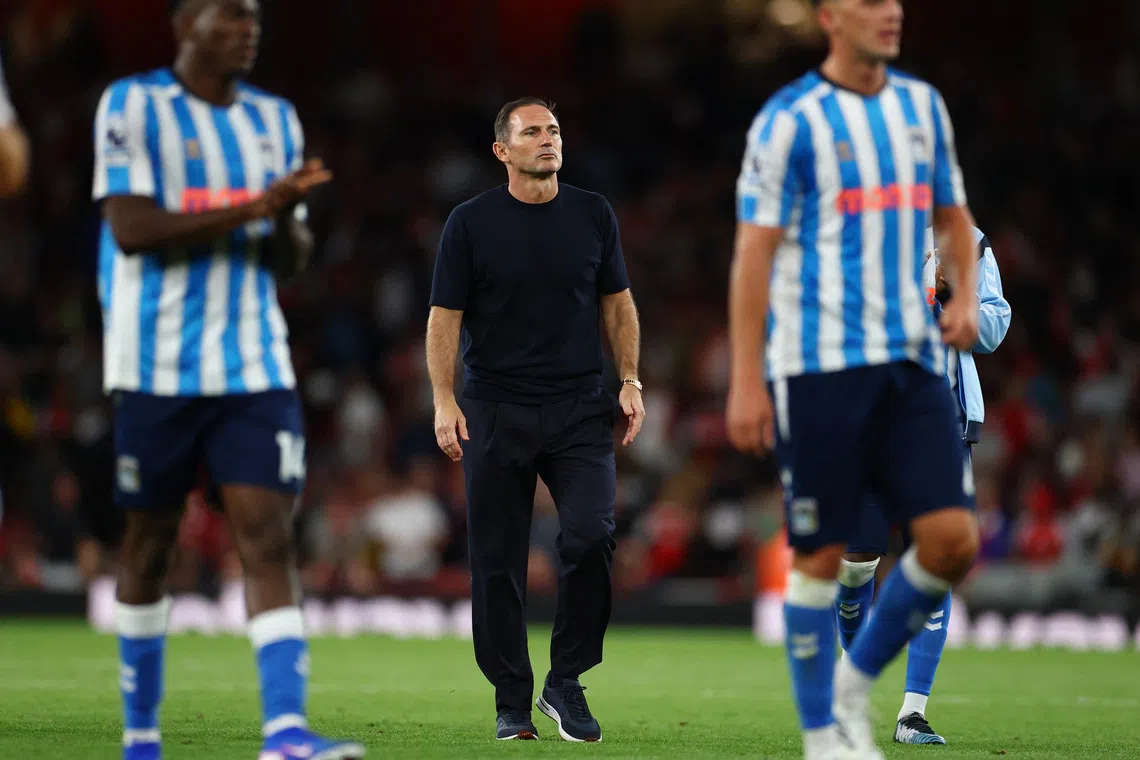 Arsenal thrashes promoted Coventry 3-0 in Premier League return