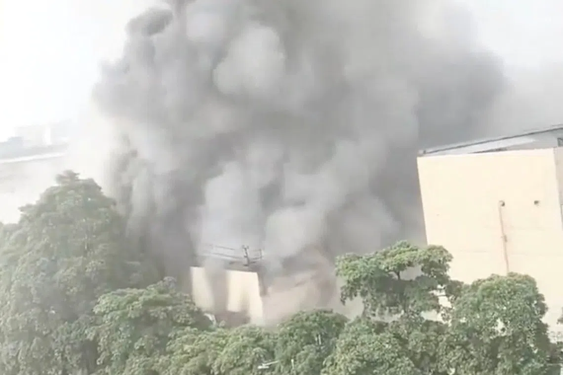 Eight dead in textile factory blaze in southern China