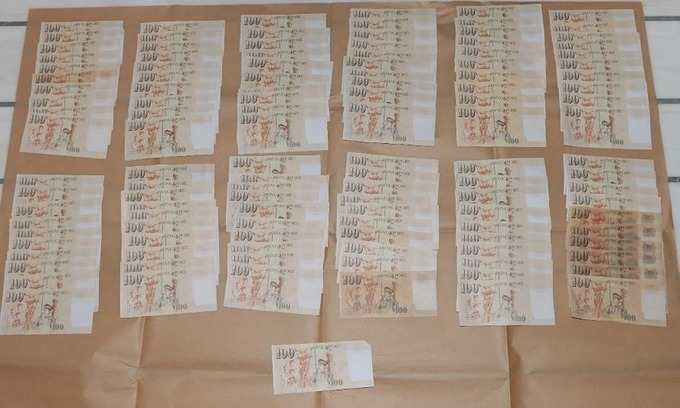 Two Chinese nationals face charges over Singapore currency counterfeiting scheme