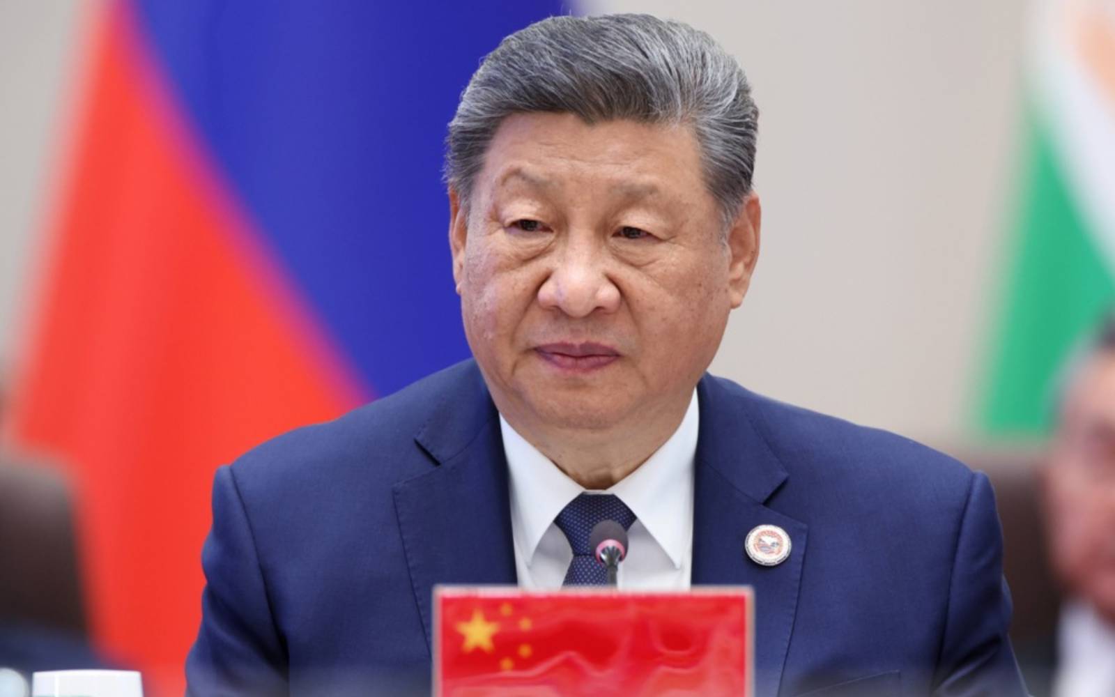 Xi pushes for quality growth, tightens party grip on military