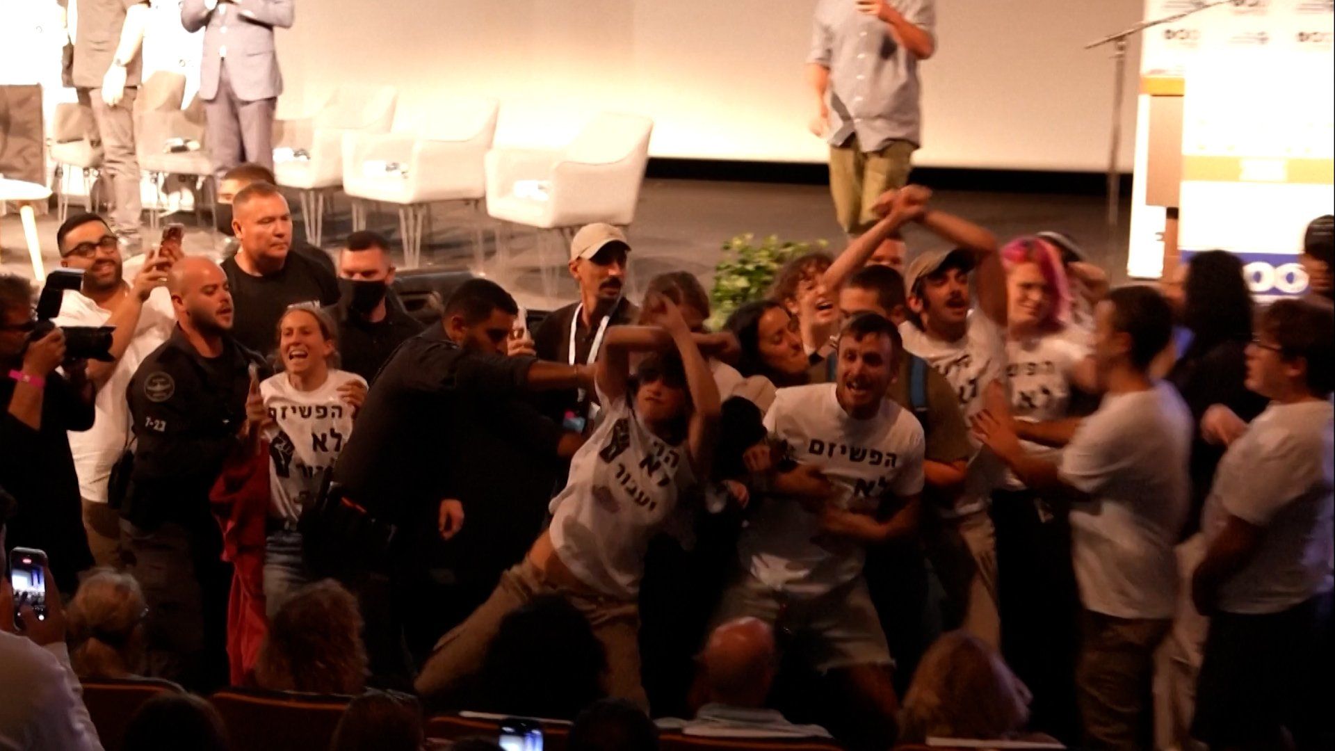 Israeli protesters force far-right minister off stage at Tel Aviv event