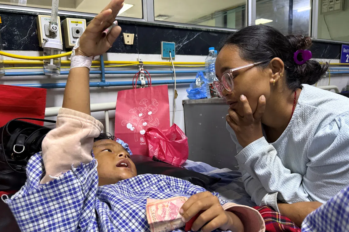 Nepali boy reunited with mother after surviving devastating floods