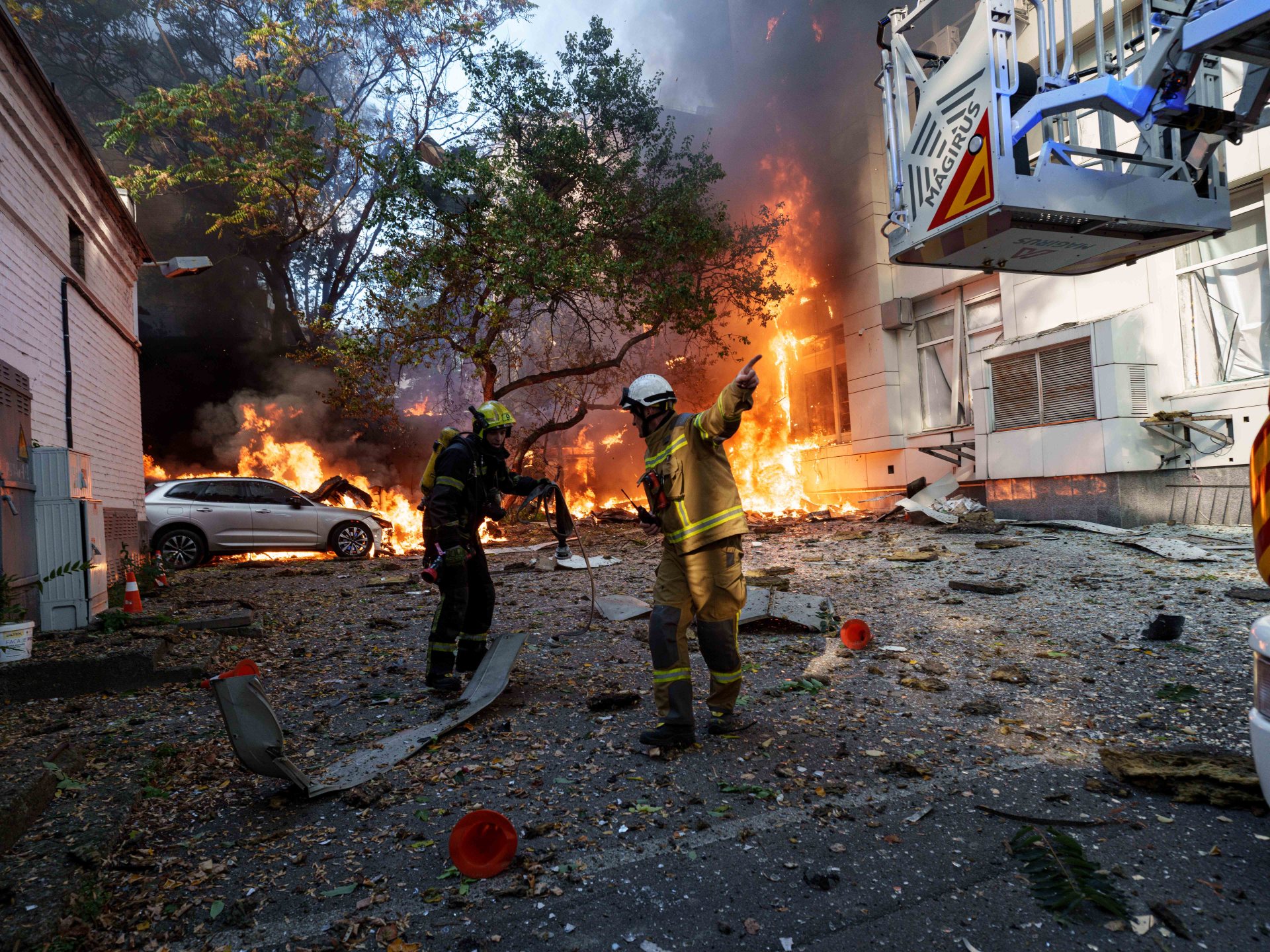 Russian drones strike Kyiv school, bridge in intensified air campaign