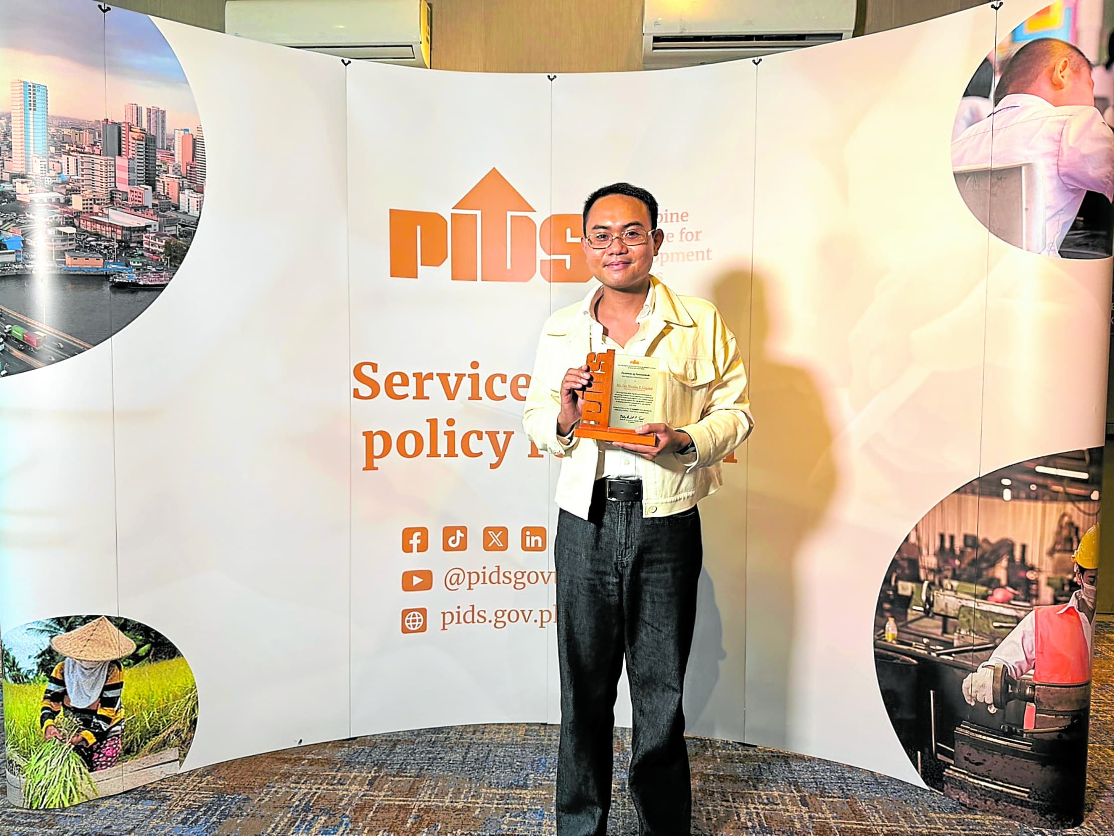 Inquirer reporter lauded for bringing development research to public
