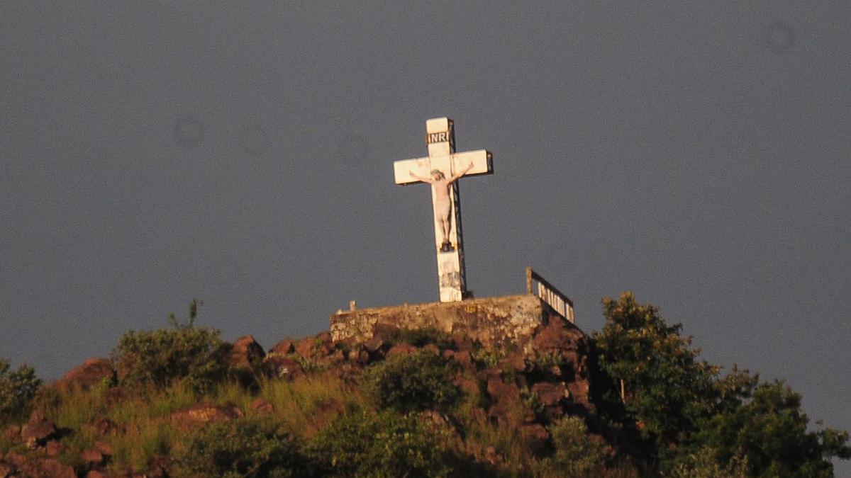 Church files complaint after tourists scale holy cross in Kerala's Munnar