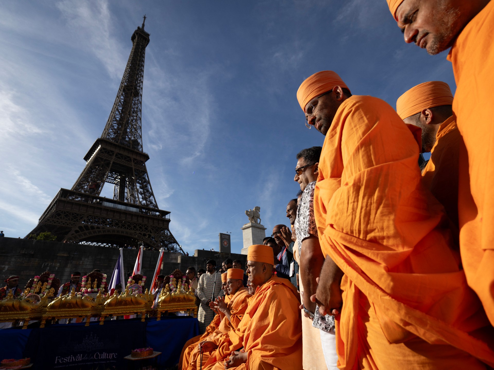 Eiffel Tower reopens after row over female staff removal request