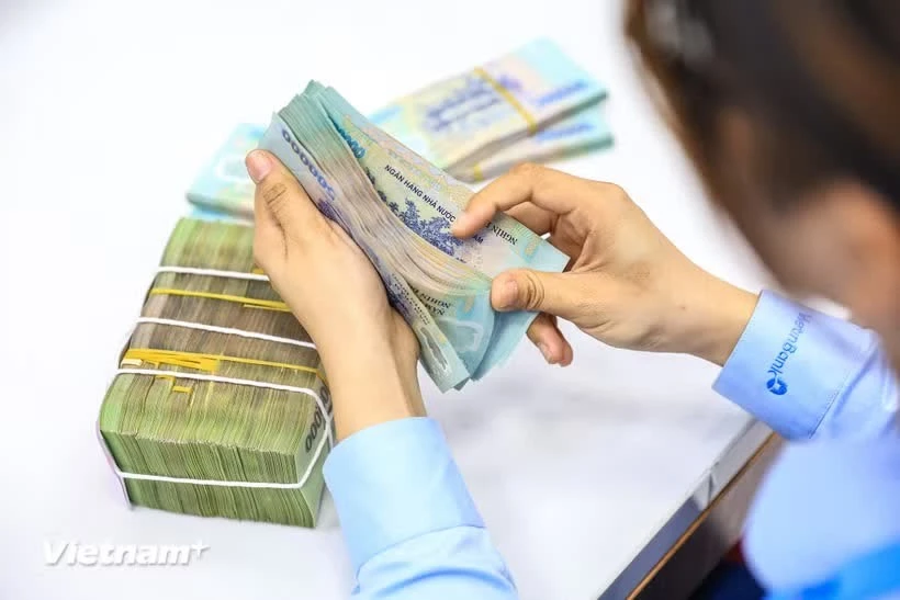 Vietnam's dollar reference rate edges higher amid trading band adjustments