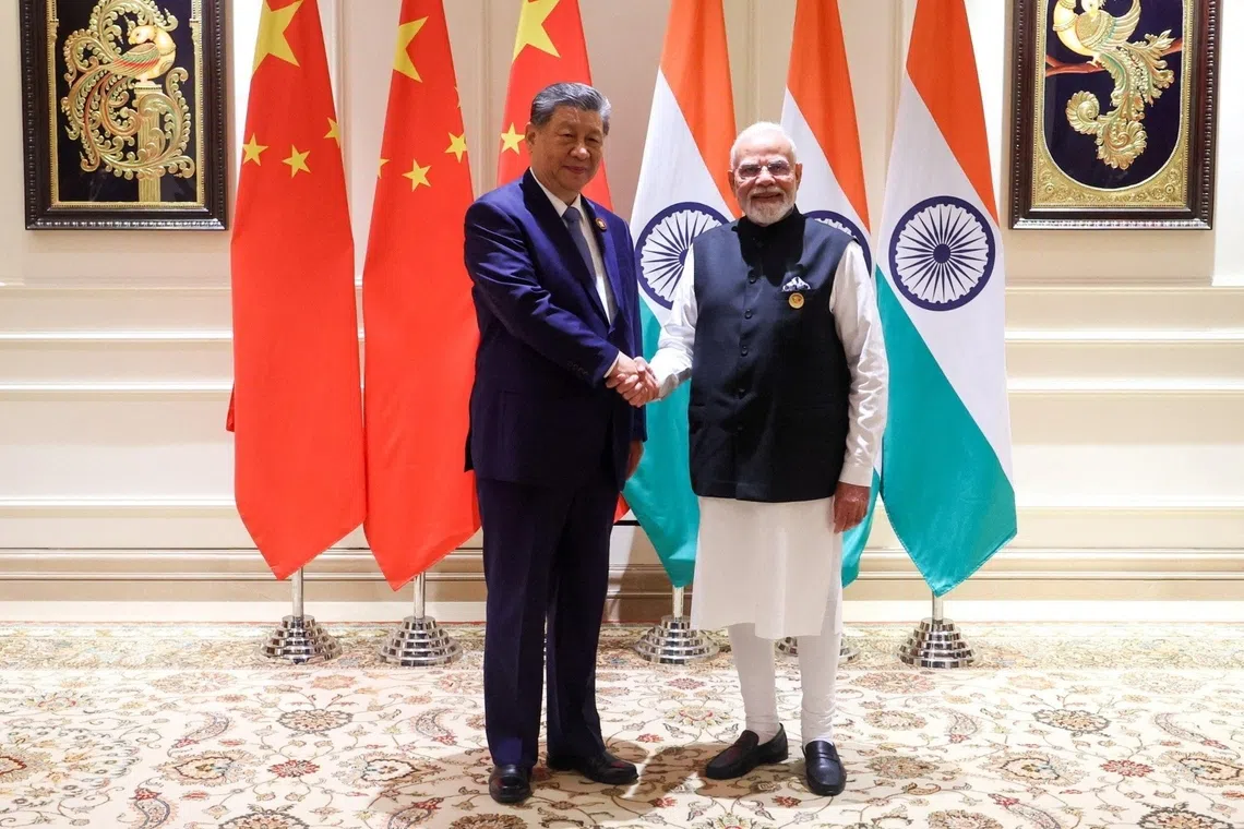 Modi-Xi handshake signals cautious thaw in India-China ties