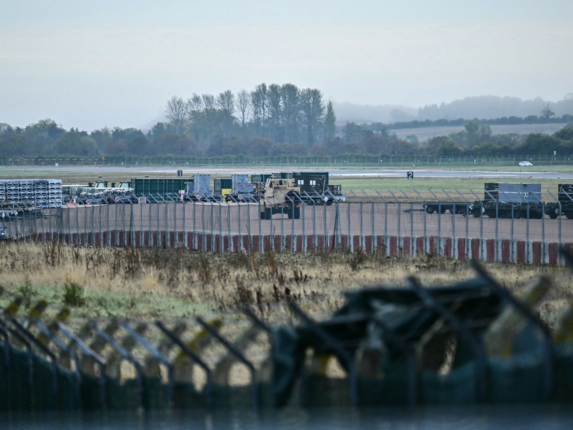 Iran denies airbase attack link as UK warns on proxy forces