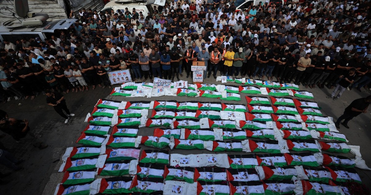 Gaza City residents lay 100 recovered Palestinians to rest