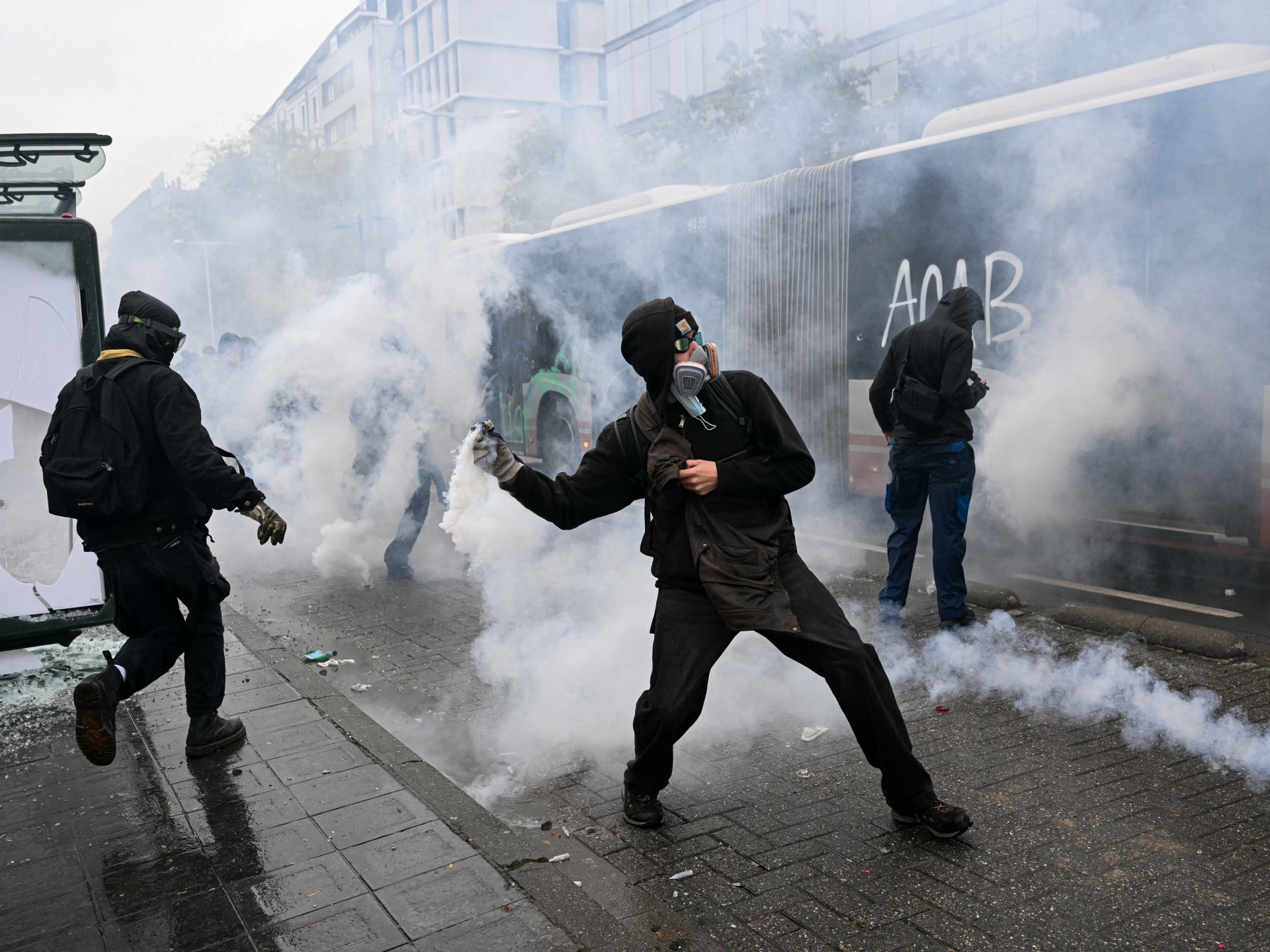 Brussels police deploy tear gas as anti-austerity protesters clash with law enforcement