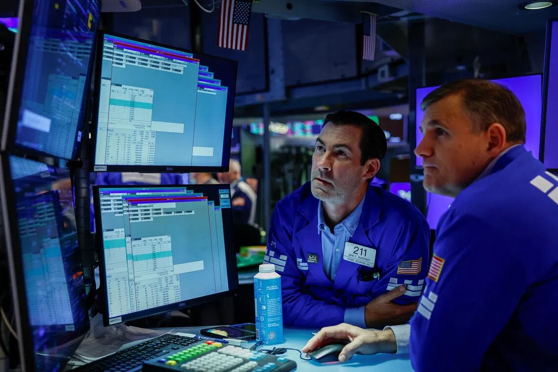 Wall Street slides as energy costs and bond yields climb higher