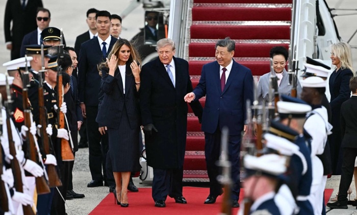 Trump extends rare airport greeting to China's Xi as summit begins