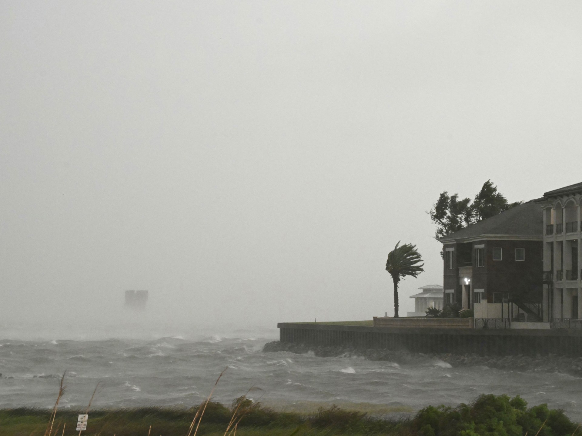 Hurricane Isaias weakens after striking US Gulf Coast, leaving hundreds of thousands without power