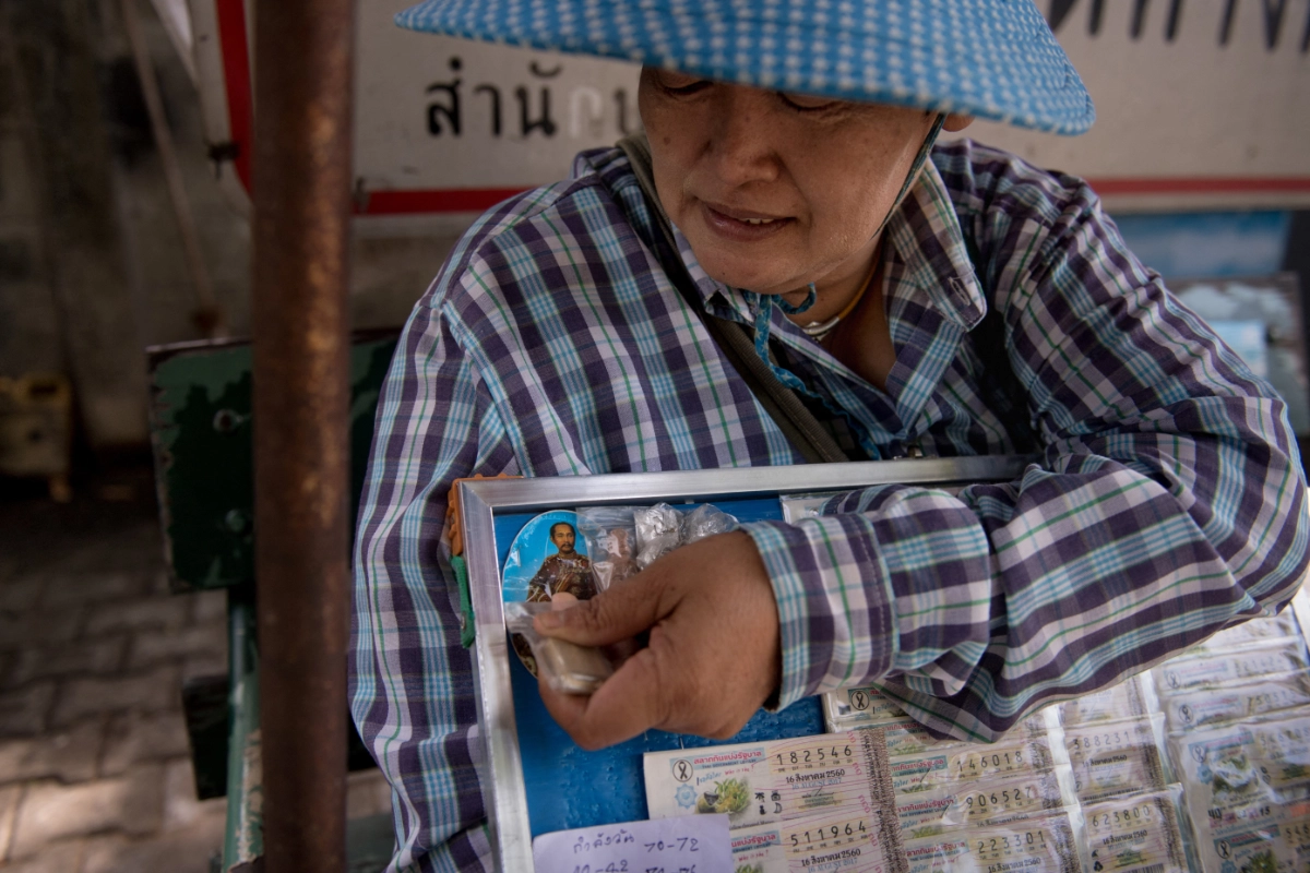 Myanmar exiles in Thailand turn to lottery for financial relief