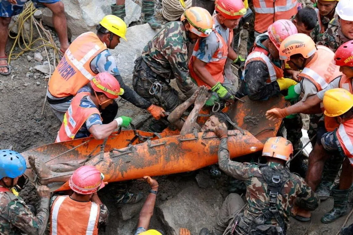 Two men rescued after nine days trapped in Nepal flood tunnel