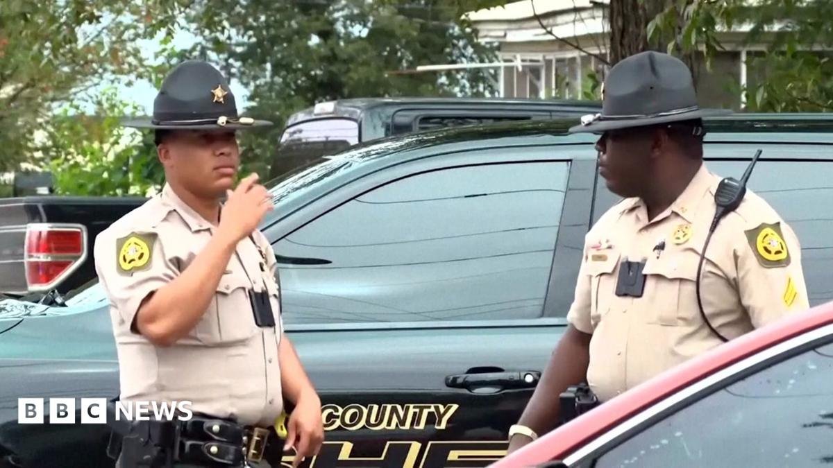 Georgia shooting leaves two dead, dozens wounded; suspect at large