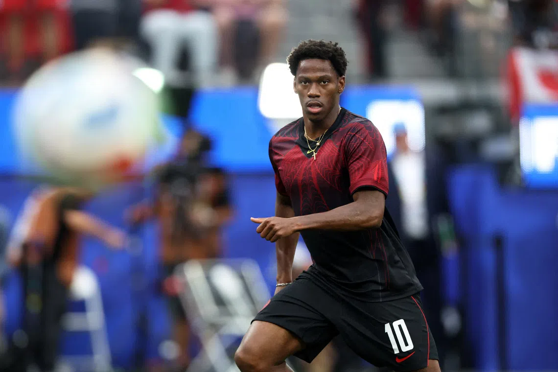 Canadian striker David joins Atletico Madrid on season-long loan