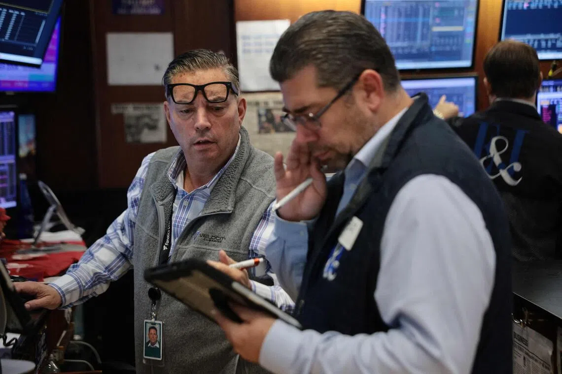 Wall Street rallies sharply as Fed official signals pause on rate hikes