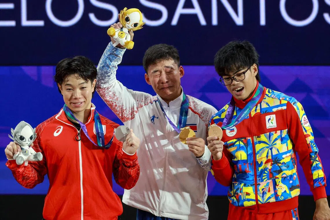 Young Japanese weightlifter claims gold as Asian Games battles empty venues