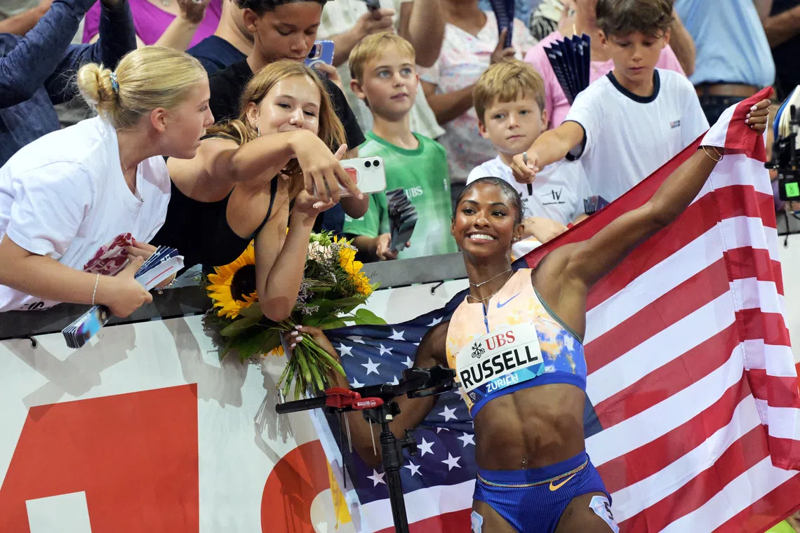 Olympic champion Russell sets sights higher after hurdles record
