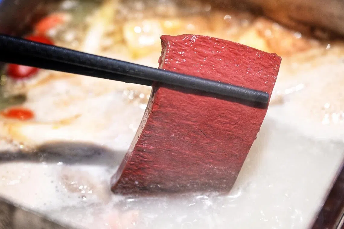 Pig's blood makes cautious comeback in Singapore's culinary scene