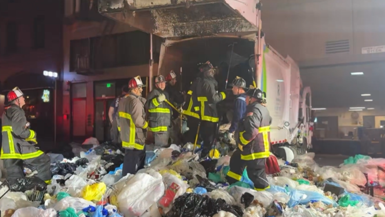 Firefighters rescue man from compacted garbage truck in dramatic operation