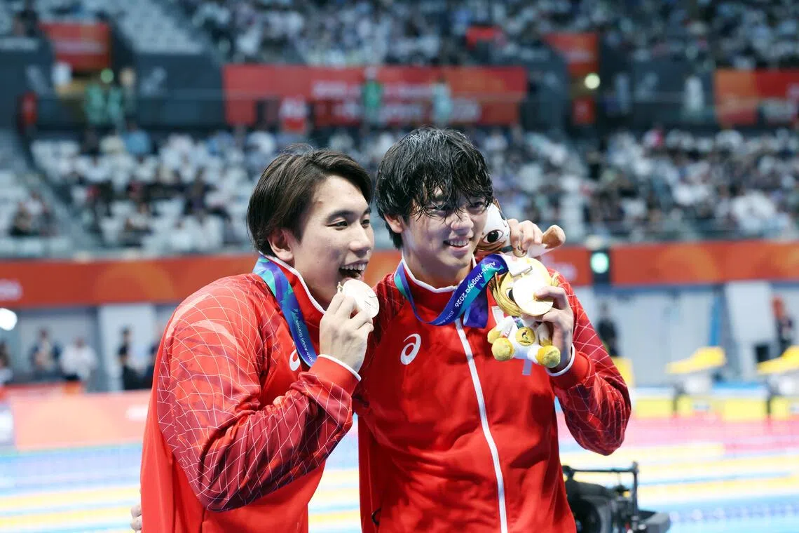 Japan's Mitsunaga shatters Schooling's Asian Games 100m butterfly record
