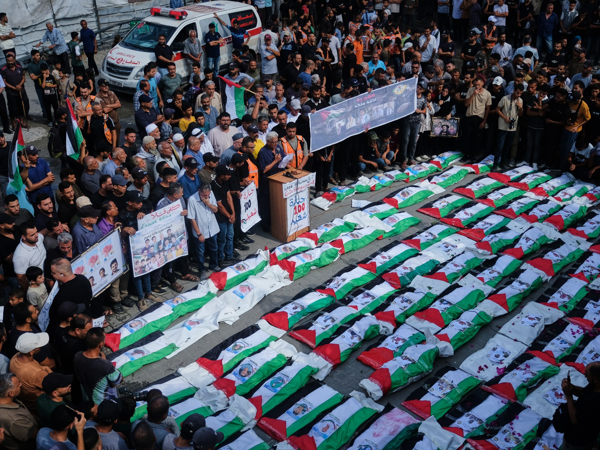Gaza residents hold mass burial as recovery efforts continue