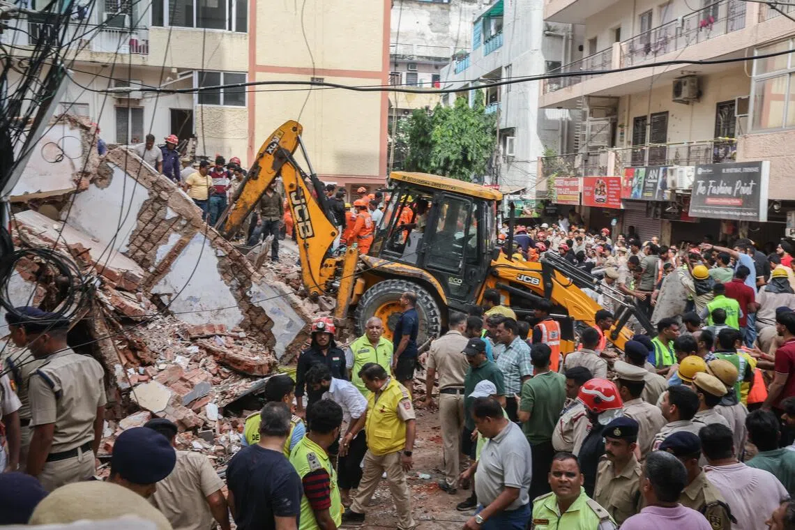 Six pulled from rubble after Delhi building collapse during repairs