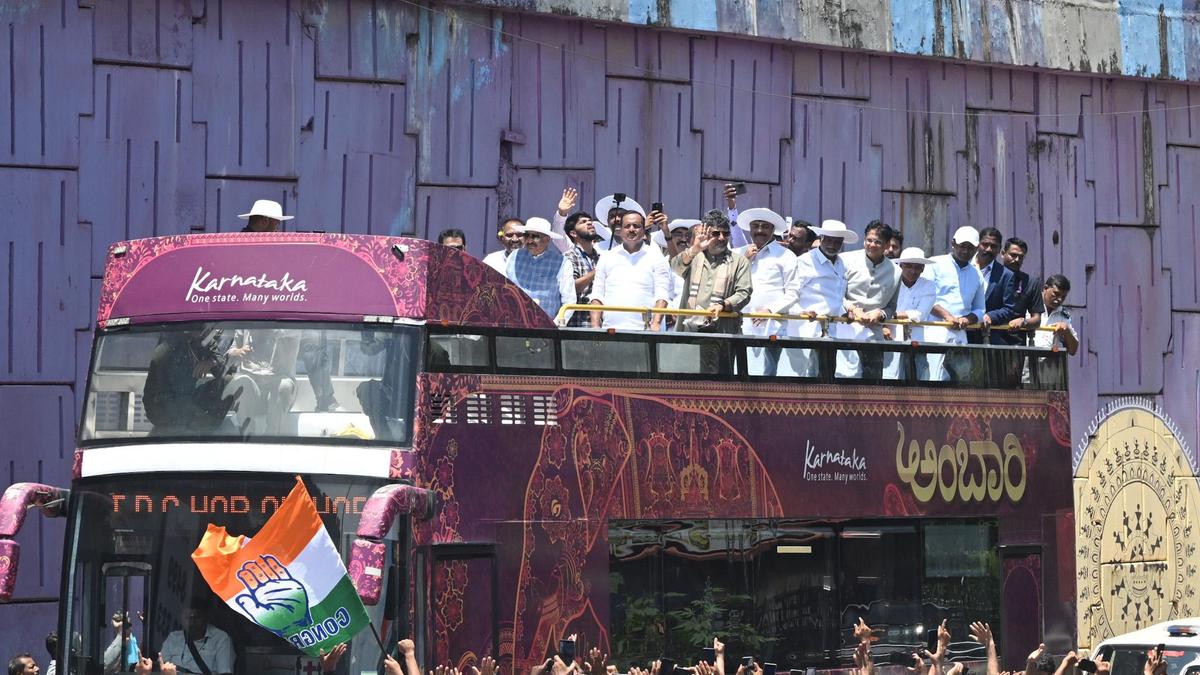 Karnataka cabinet processes in open-top bus to Mangaluru meeting