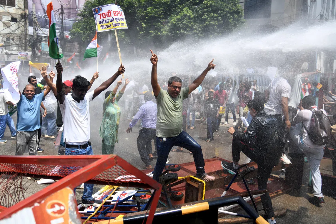 Indian police deploy water cannons against protesters over exam paper breach