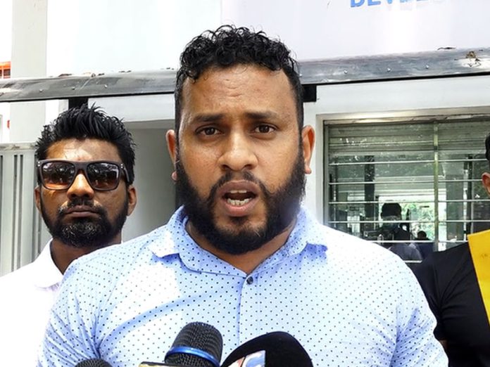 Man arrested with eight firearms in connection with double murder