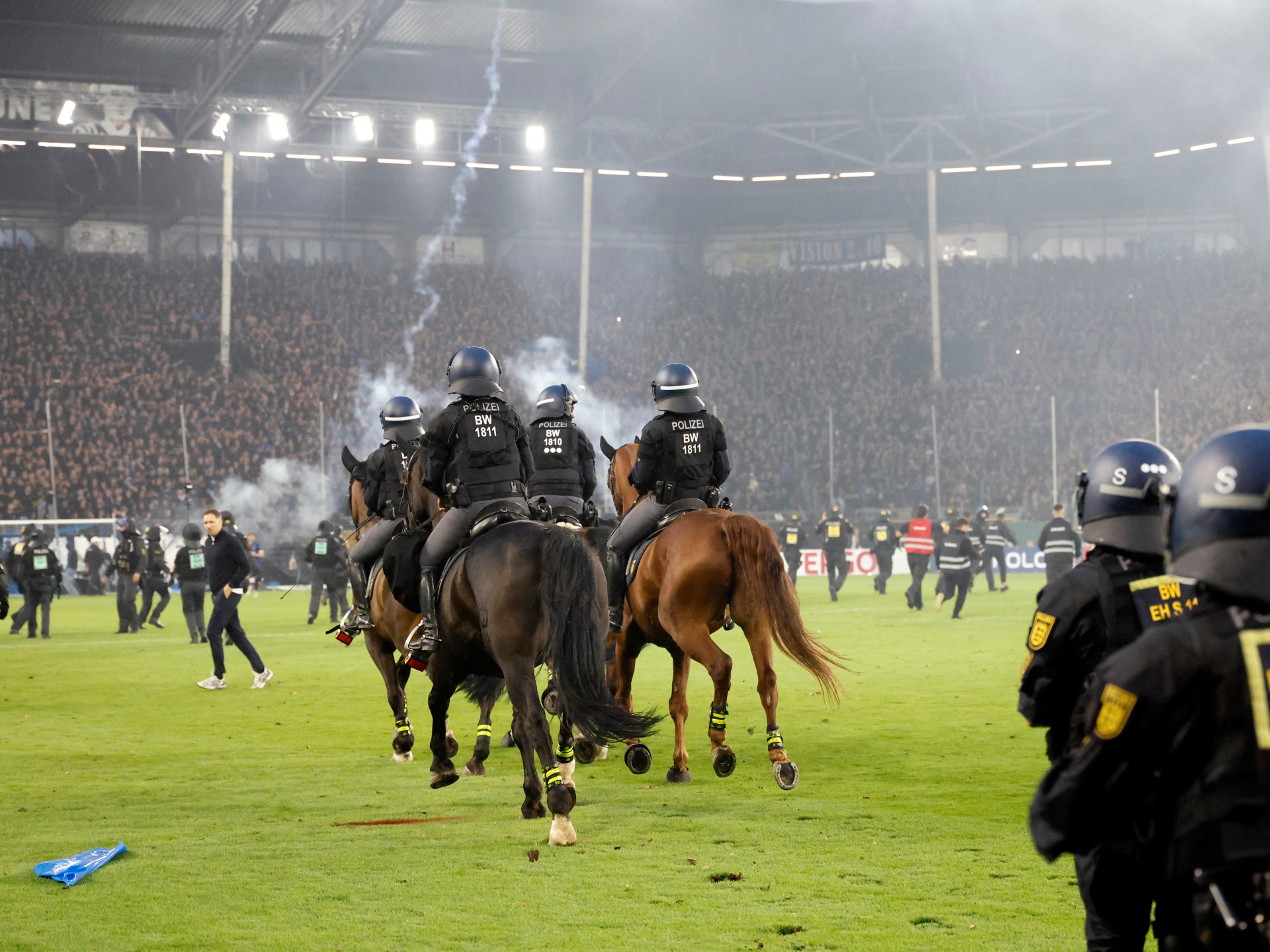 German Cup match abandoned after violent pitch invasion injures dozens