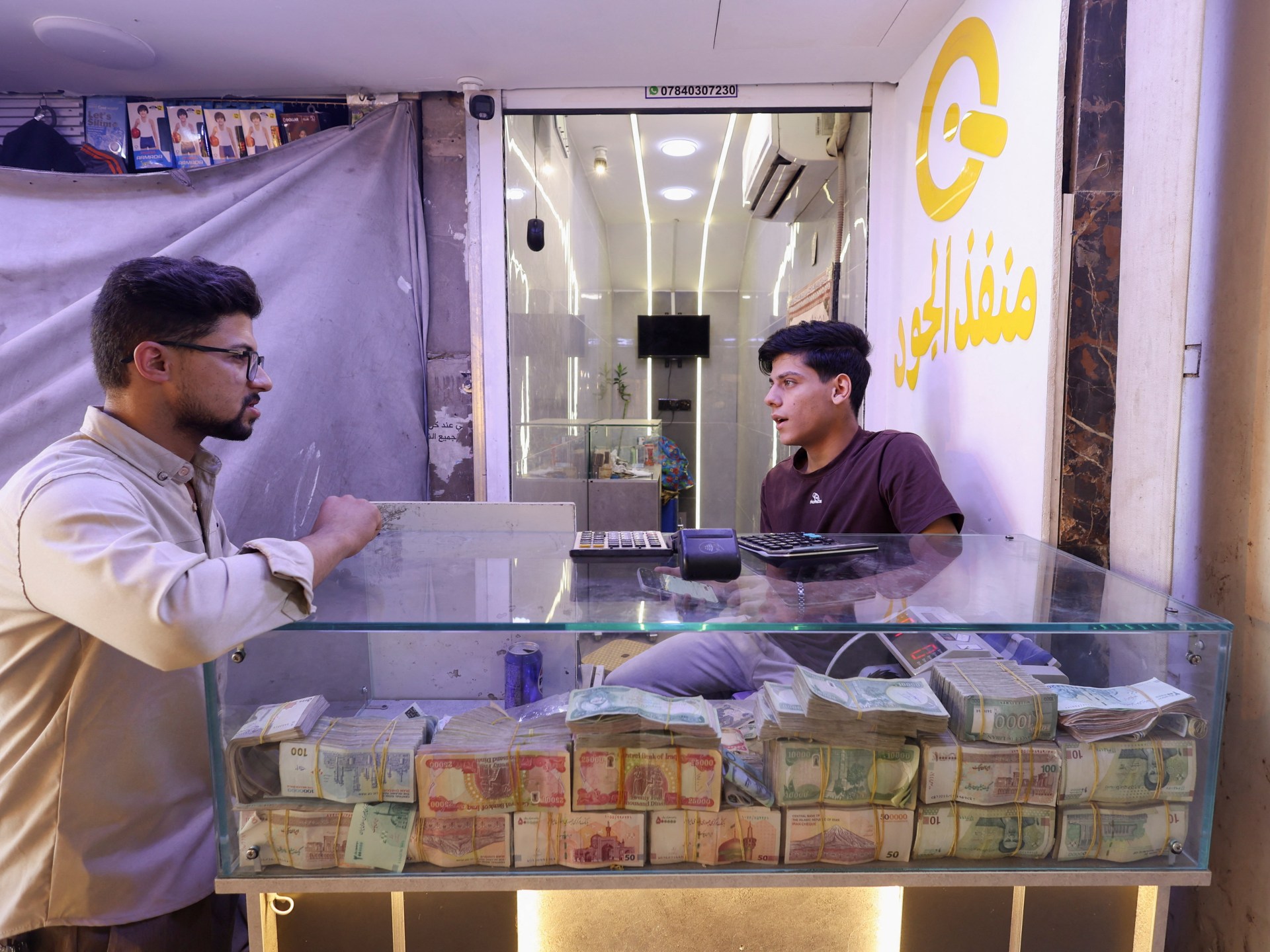 Iraq's currency devaluation sparks parliamentary opposition over living costs