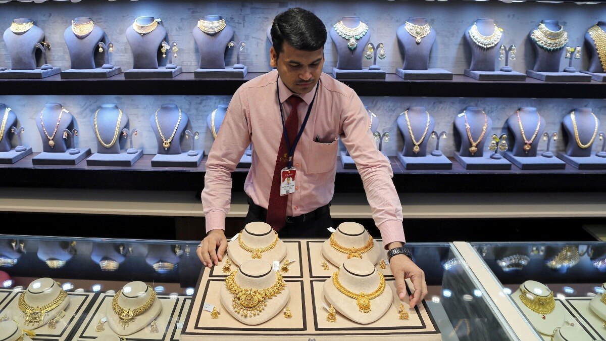 Gold slides 3.4% globally as Indian prices hold firm