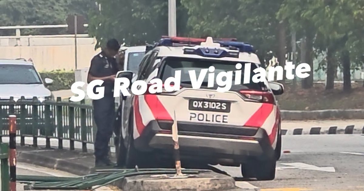 Police vehicle hits road divider in traffic incident