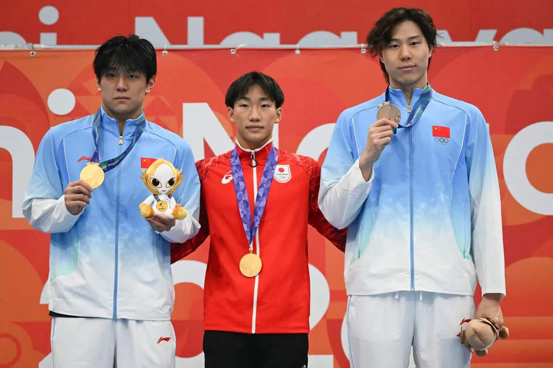 Ohashi breaks world record in swimming; Qin concedes rival's brilliance