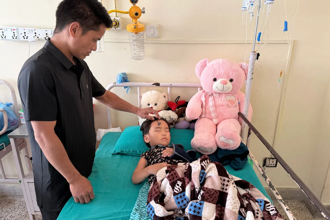 Young flood survivor reunited with parents in Kathmandu after Nepal disaster