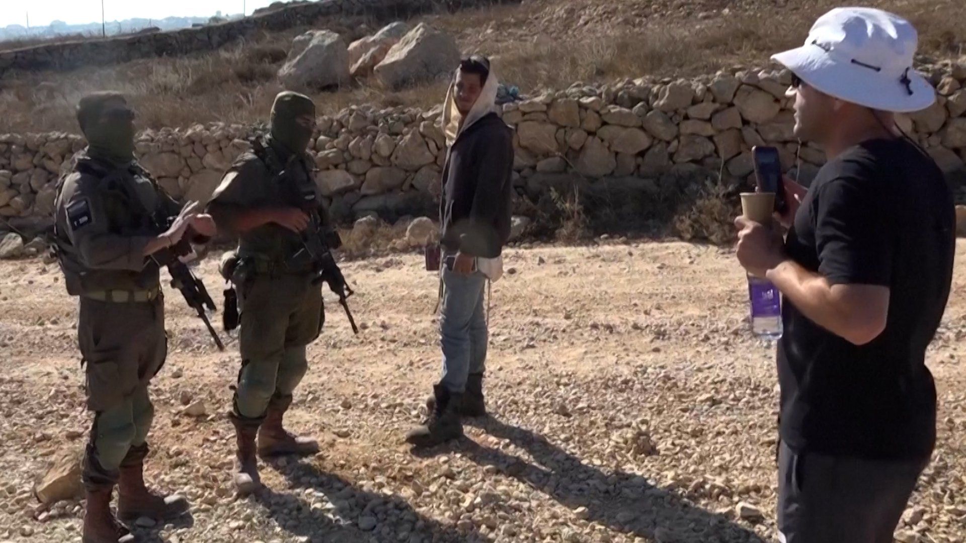 Palestinian-American activist confronts Israeli settler in West Bank village